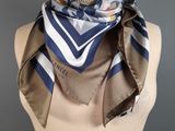a close up of a mannequin torso with a scarf on it