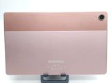 the back of a pink tablet computer sitting on top of a white surface