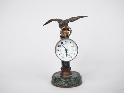 a clock with an eagle on top of it