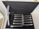 a box with a set of silverware inside of it