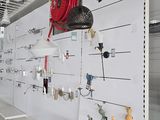 a room with a lot of shelves with various items on it