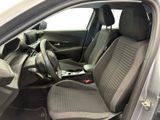 the interior of a car with a laptop in the passenger seat