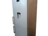a silver refrigerator that is on display against a white background