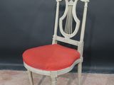 an image of a chair with a red seat and a white back