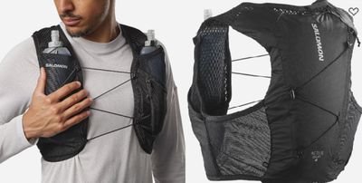 the man is wearing a black vest and a white t - shirt