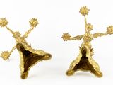 pair of gold plated candlesticks with flowers and leaves