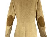 an image of a woman ' s jacket on a mannequin mannequin stand