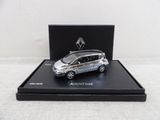 the small silver car is in a black box on a white surface