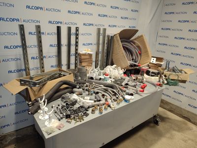 many different types of pipes and fittings on a table