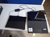two laptops that are sitting on a table