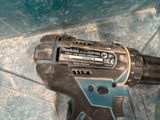 a cordless drill that is sitting on the floor