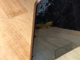 a phone that is sitting on top of a wooden table