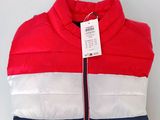 a red, white and blue jacket with a tag on it