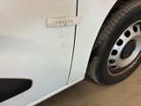 a close up of a white car with a sticker on it
