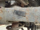 a close up of a rusted metal object on a motorcycle