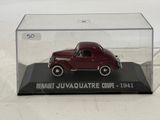 a red toy car in a clear display case