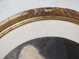 portrait of a man with a beard in a gold frame
