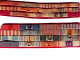 pair of multicolored belts with metal buckles on a white background