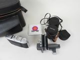 a camera, a camera case, and other items on a table