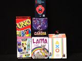 a lot of different games on a black table