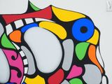 a picture of a colorful piece of art on the wall