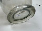 a glass jar with a lid sitting on a table