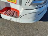a close up of a car ' s bumper with a sticker on it