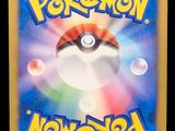 a close up of a pokemon card on a black background