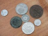 a lot of coins that are on the table