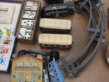 a lot of toy trains on the floor next to each other