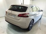 a picture of a white car parked in a garage