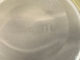 a close up view of a metal container with a lid