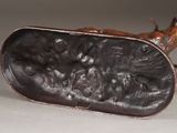 a bronze figurine of a man and a dog