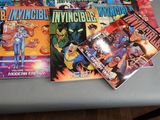 a lot of comic books sitting on a table