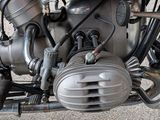 a close up of a motorcycle engine on a street