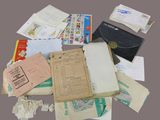 a pile of papers and envelopes sitting on a table