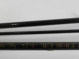 a couple of fishing rods sitting next to each other on a table