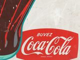 a coca cola sign on the side of a building