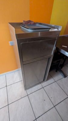 a small kitchen with a stainless steel counter top