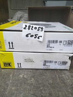two boxes of yellow and black ink are stacked on top of each other