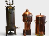 three different types of copper pots on a white background