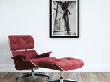 an image of a red chair and ottoman in a white room