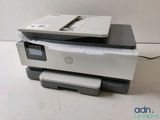 the printer is sitting on top of the paper on the table