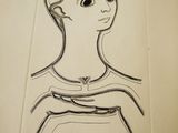an open book with a drawing of a woman ' s face on it