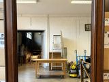a mirror that is sitting on a table in a room