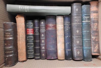 many old books on a shelf in a box