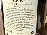 a bottle of wine sitting on a table with a label on it