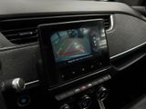 the dashboard of a car with a gps device in the center