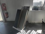 two chairs in a room with a window in the background