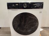 a washing machine sitting on a pallet in a room